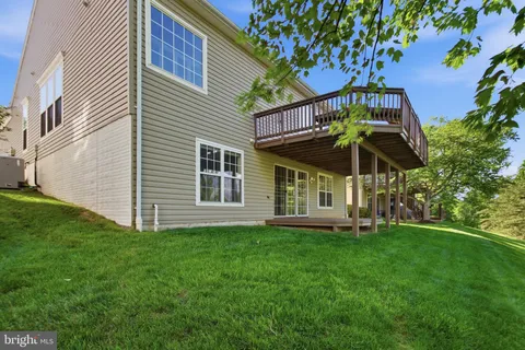 an aerial view of a house with yard swimming pool and outdoor seating