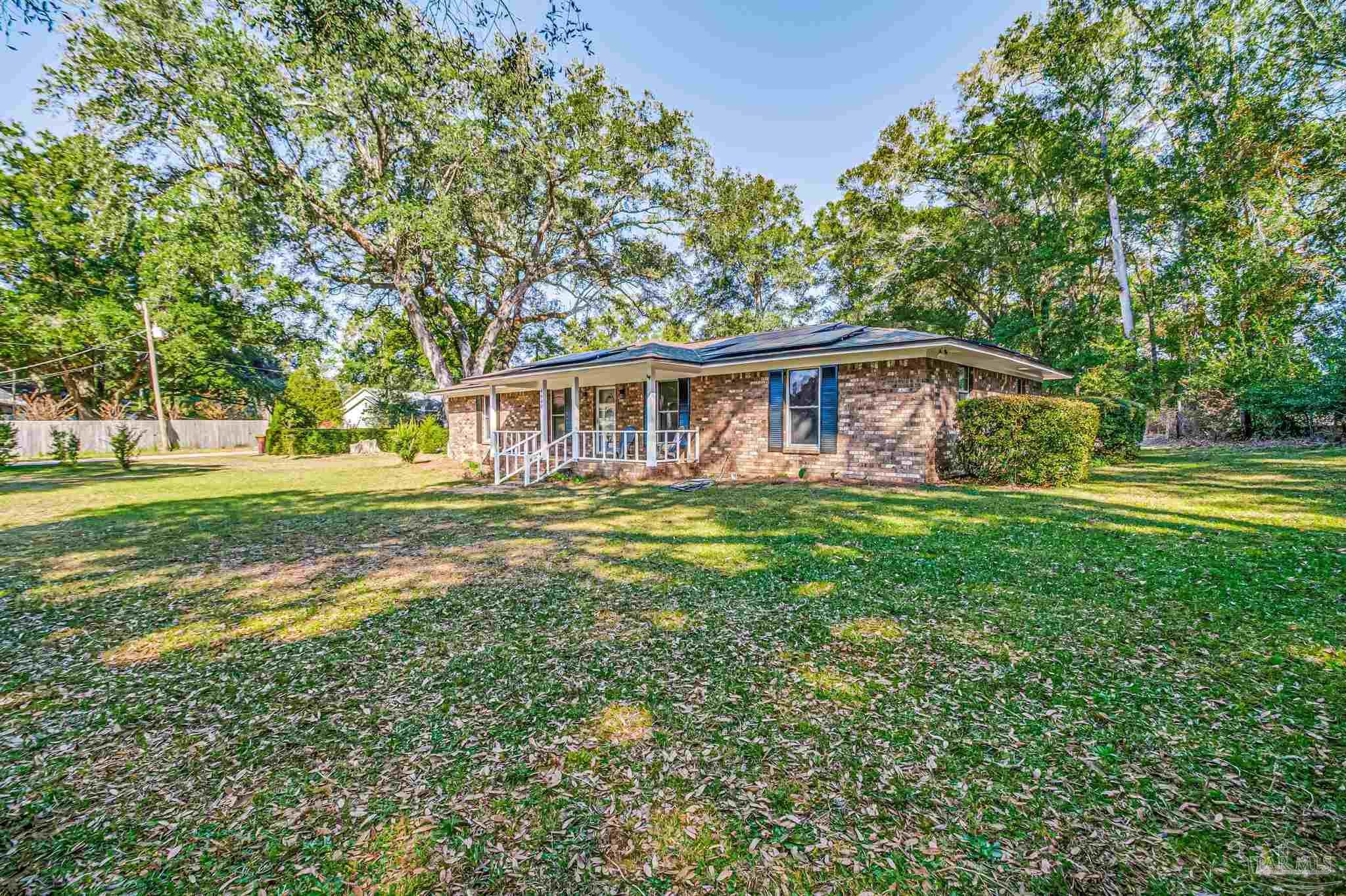 4640 Bessinger Lane Pace, FL 32571 - Photo 37 of 54 a view of a house with a yard