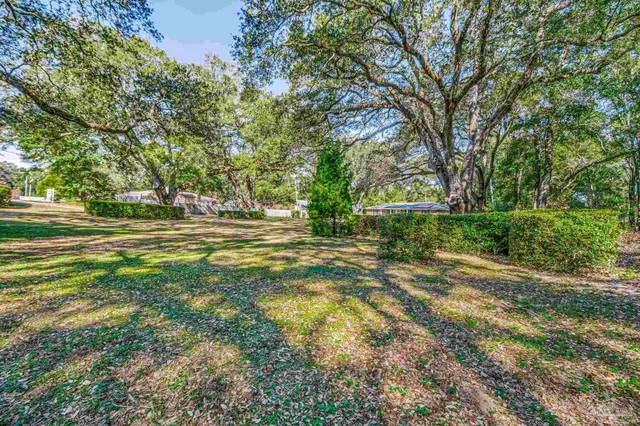 a view of a house with a street