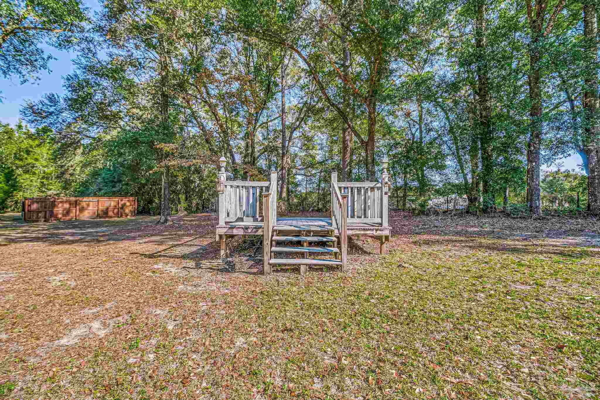4640 Bessinger Lane Pace, FL 32571 - Photo 48 of 54 a view of a house with backyard and sitting area