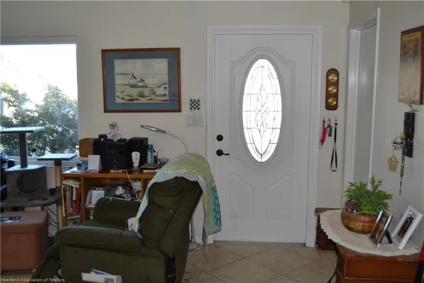 a view of a dining room with furniture and a large window