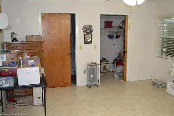 a view of work space with furniture and closet