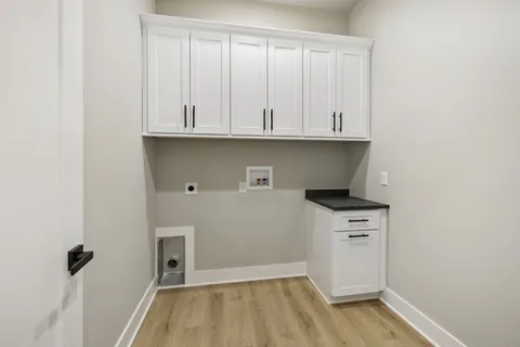 a view of cabinets and wooden floor