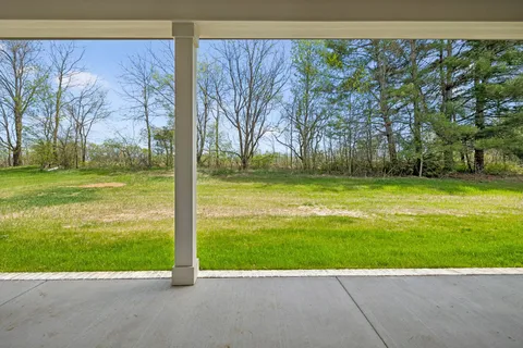 a view of a building with a yard
