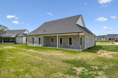 a view of a house with a big yard