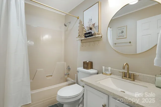 a white toilet sitting next to a bathroom sink