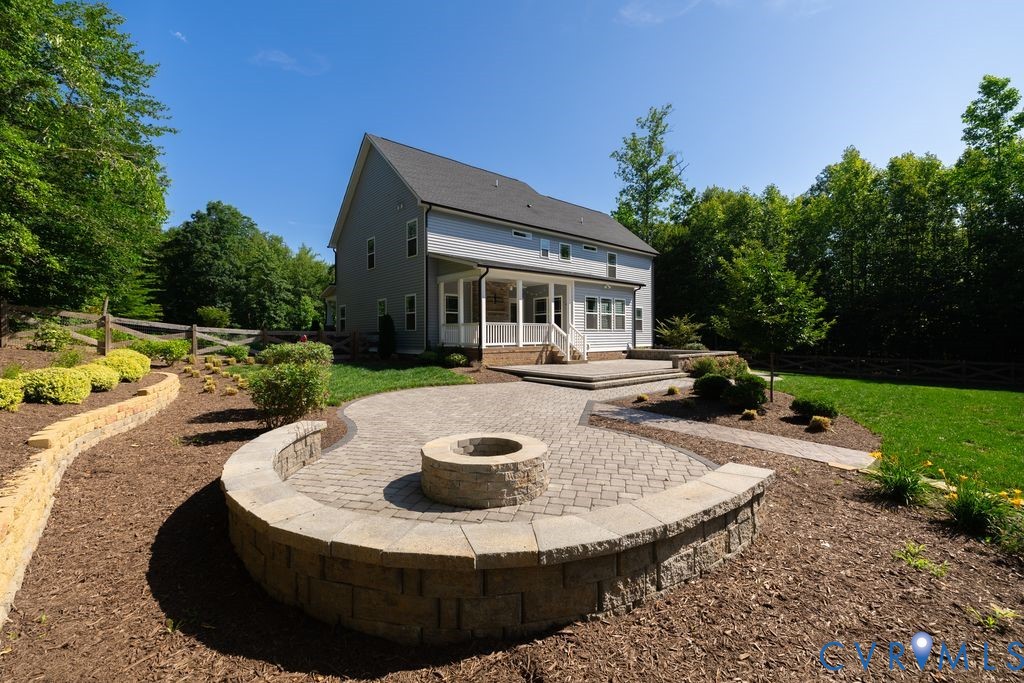 9377 Magnolia Blossom Road Ashland, VA 23005 - Photo 12 of 49 a view of a house with backyard swimming pool and sitting area