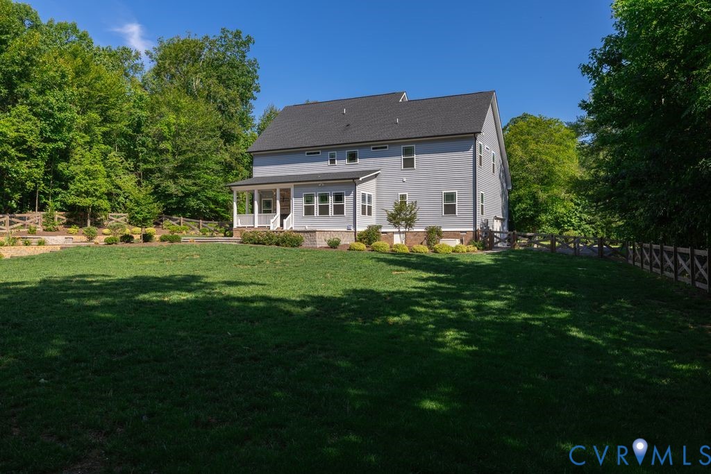 9377 Magnolia Blossom Road Ashland, VA 23005 - Photo 15 of 49 a front view of a house with a garden