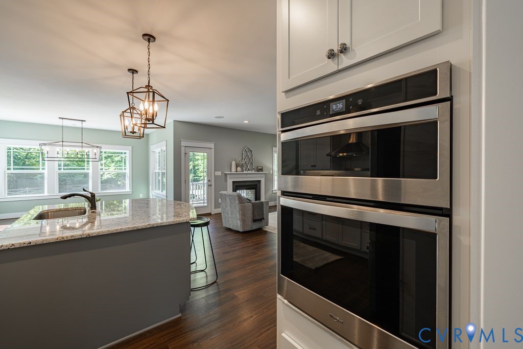 9377 Magnolia Blossom Road Ashland, VA 23005 - Photo 20 of 49 a kitchen with a stove and a microwave