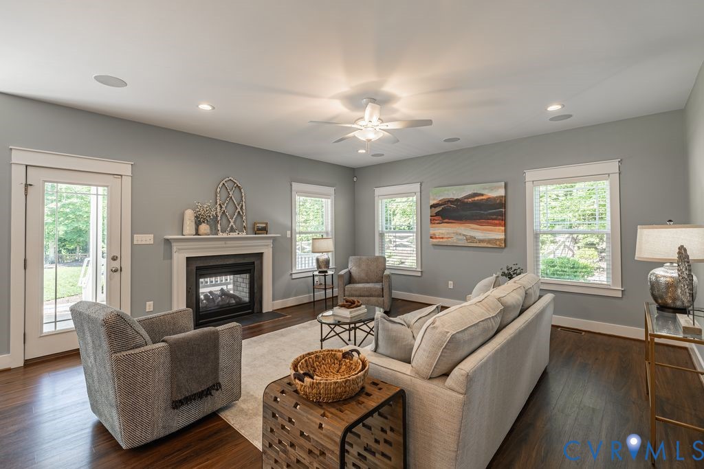 9377 Magnolia Blossom Road Ashland, VA 23005 - Photo 23 of 49 a living room with furniture and a fireplace