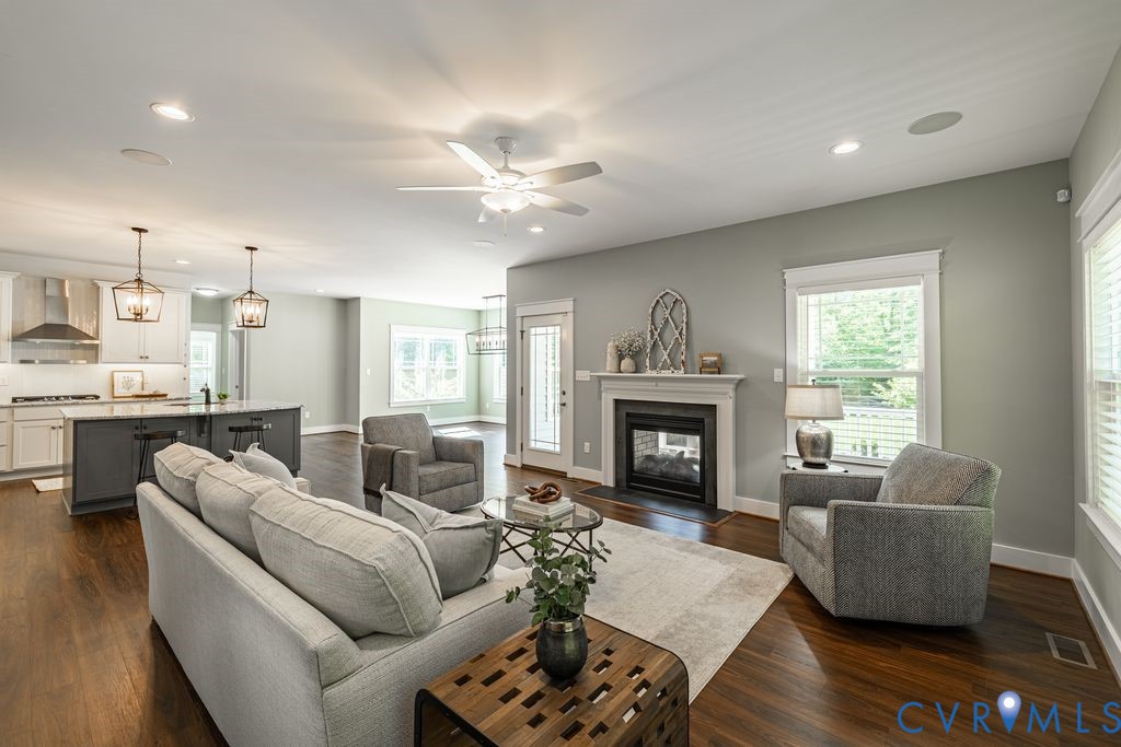 9377 Magnolia Blossom Road Ashland, VA 23005 - Photo 24 of 49 a living room with furniture and a fireplace