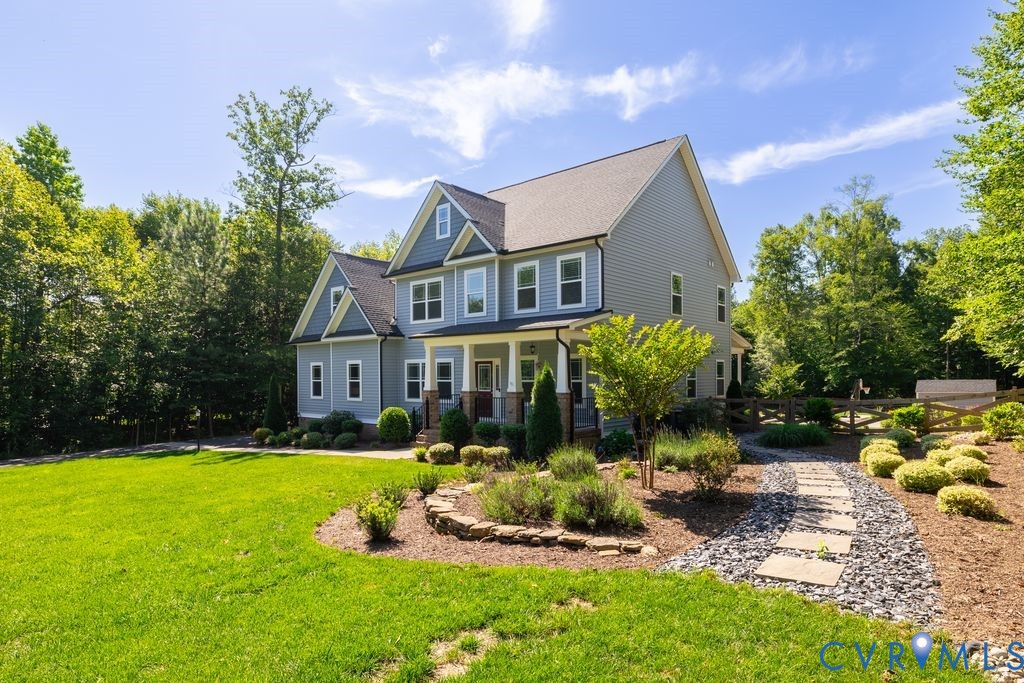 9377 Magnolia Blossom Road Ashland, VA 23005 - Photo 3 of 49 a front view of house with yard and green space
