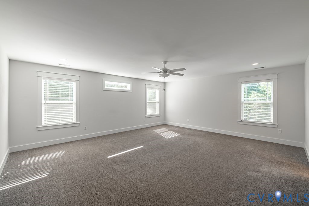 9377 Magnolia Blossom Road Ashland, VA 23005 - Photo 30 of 49 an empty room with a empty space and windows