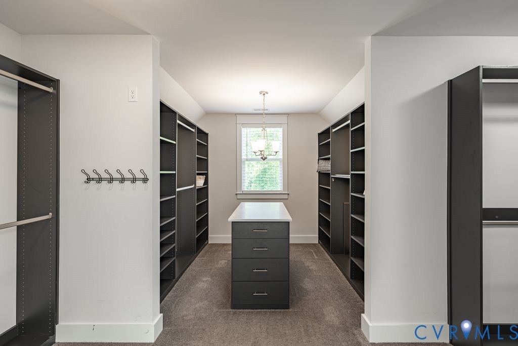 9377 Magnolia Blossom Road Ashland, VA 23005 - Photo 33 of 49 a view of walk in closet with clothes and shoes