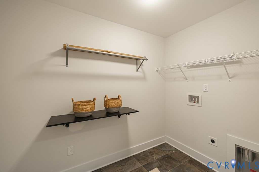 9377 Magnolia Blossom Road Ashland, VA 23005 - Photo 37 of 49 a view of storage and utility room with racks on the wall