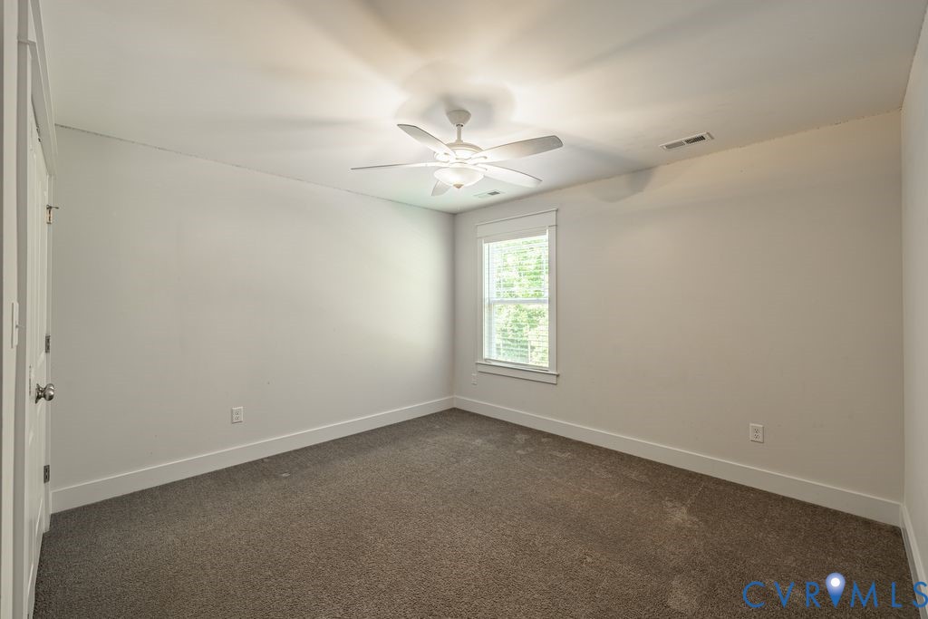 9377 Magnolia Blossom Road Ashland, VA 23005 - Photo 40 of 49 an empty room with a window and a fan