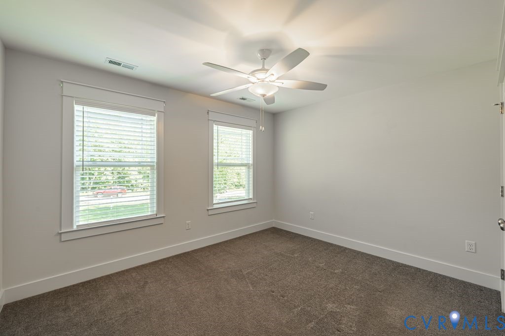 9377 Magnolia Blossom Road Ashland, VA 23005 - Photo 41 of 49 an empty room with a window and a fan