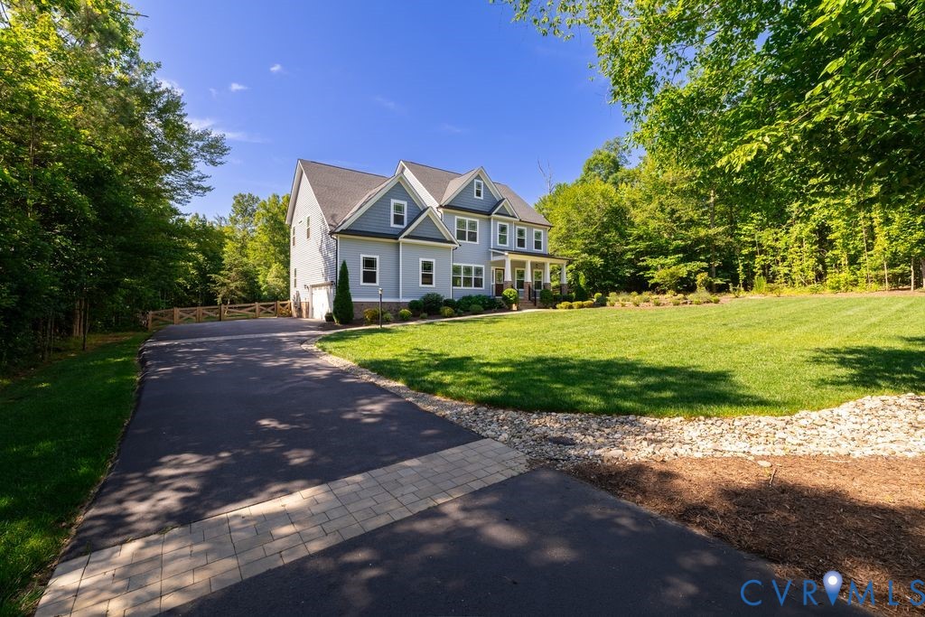 9377 Magnolia Blossom Road Ashland, VA 23005 - Photo 5 of 49 a front view of a house with a yard