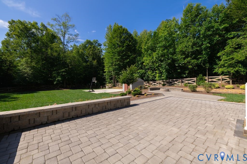 9377 Magnolia Blossom Road Ashland, VA 23005 - Photo 7 of 49 a swimming pool with outdoor seating and garden