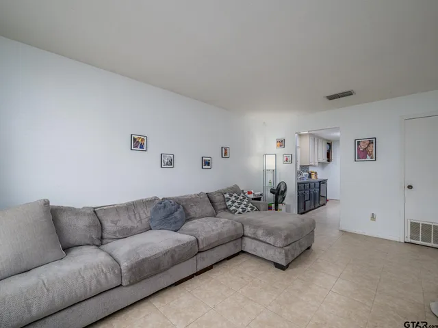 a living room with furniture and a couch