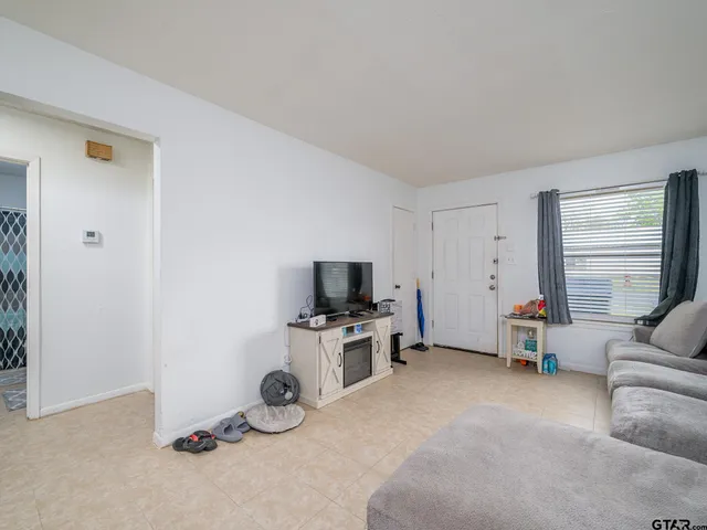 a room with furniture and a flat screen tv