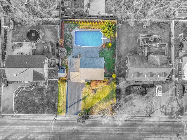 an aerial view of a house with a swimming pool
