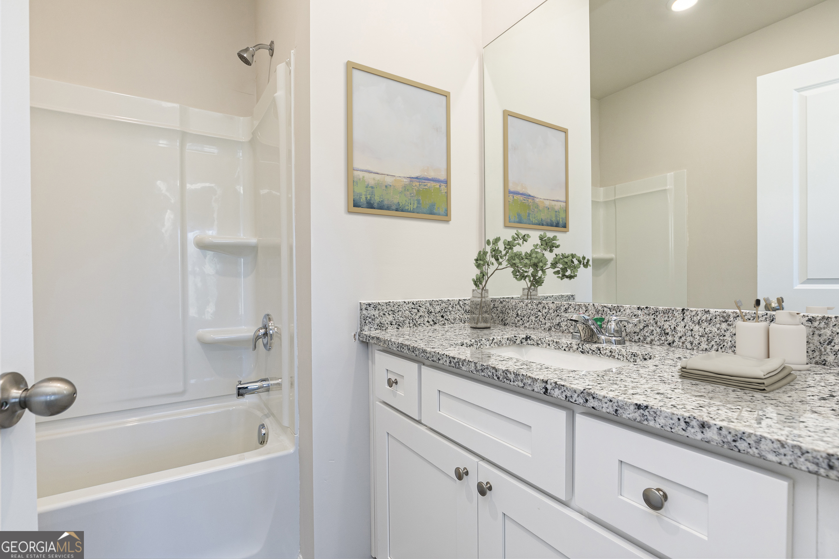 241 Rooker Drive LaGrange, GA 30241 - Photo 13 of 15 a bathroom with a granite countertop sink mirror and a bathtub