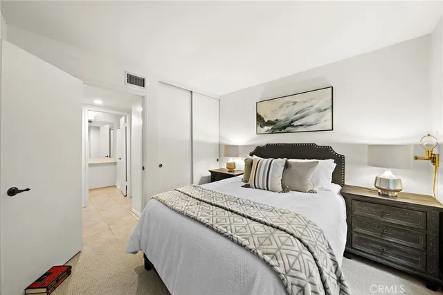 a bedroom with a bed and closet