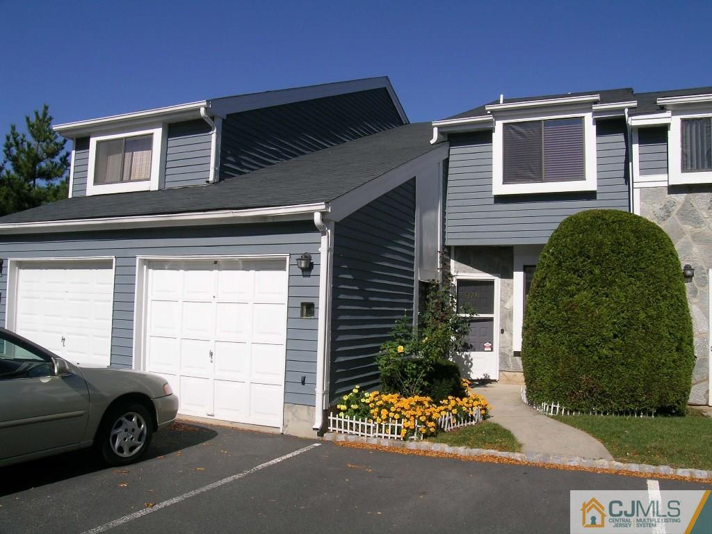 5802 Hana Road Edison, NJ 08817 - Photo 1 of 17 front view of a house with a car parked in front of it