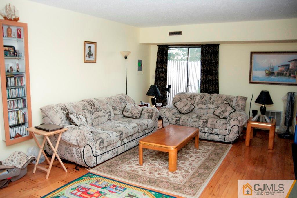 5802 Hana Road Edison, NJ 08817 - Photo 3 of 17 a living room with furniture and a large window