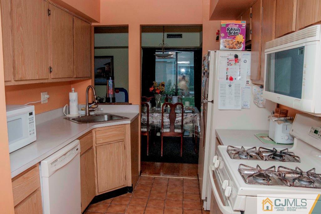 5802 Hana Road Edison, NJ 08817 - Photo 4 of 17 a kitchen with a sink and cabinets