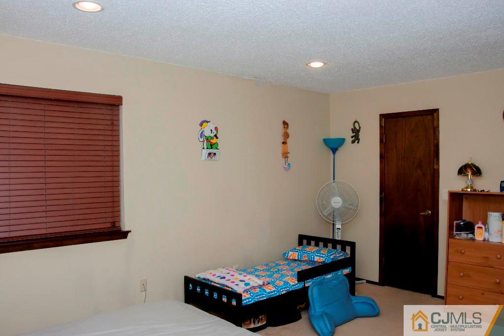 5802 Hana Road Edison, NJ 08817 - Photo 7 of 17 a room with toys and wooden floor