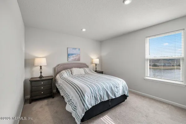 a bedroom with a bed and closet