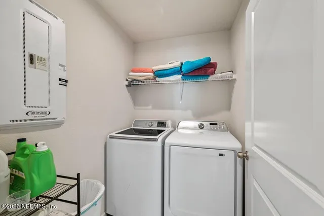 a view of room with stairs and a window