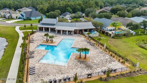 a view of a swimming pool with seating space