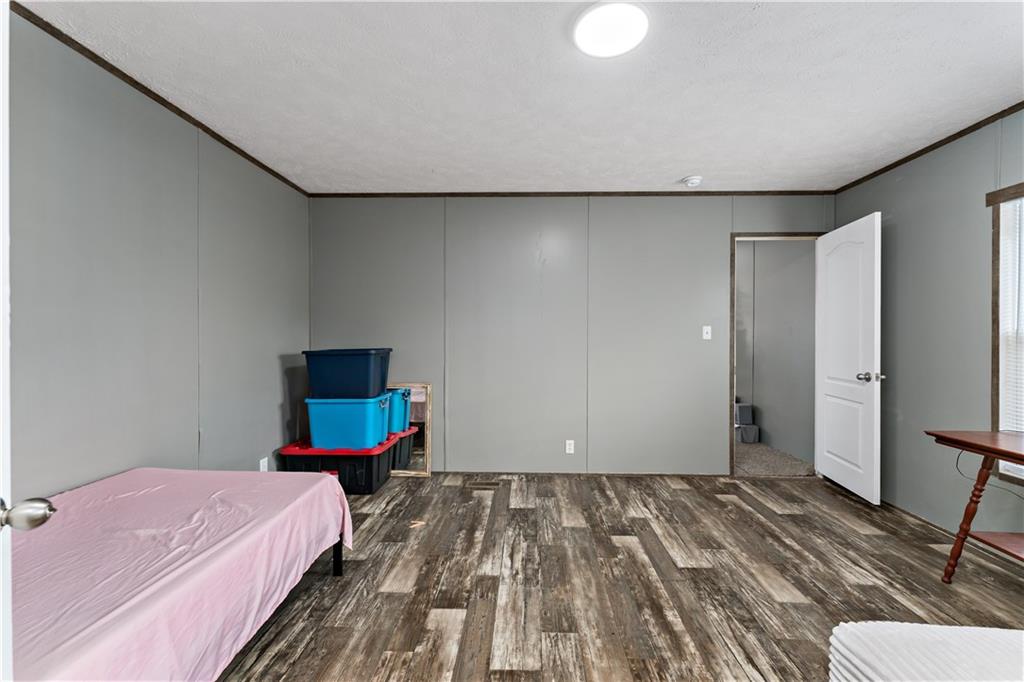 48 Brookhaven Avenue Washington, PA 15301 - Photo 13 of 35 a bedroom with a bed and wooden floor