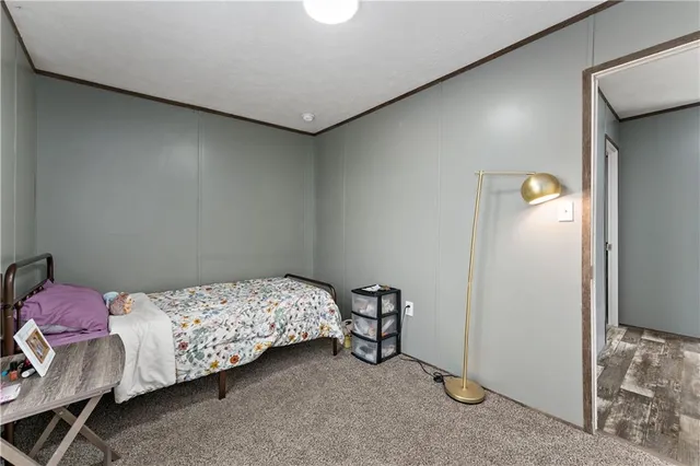 a bedroom with a bed and a table