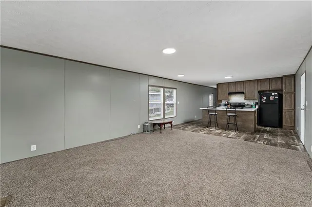 a view of a livingroom with storage & utility room