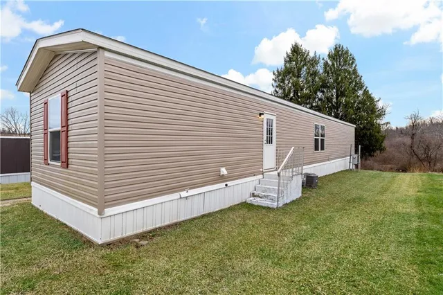 a view of a back yard of the house