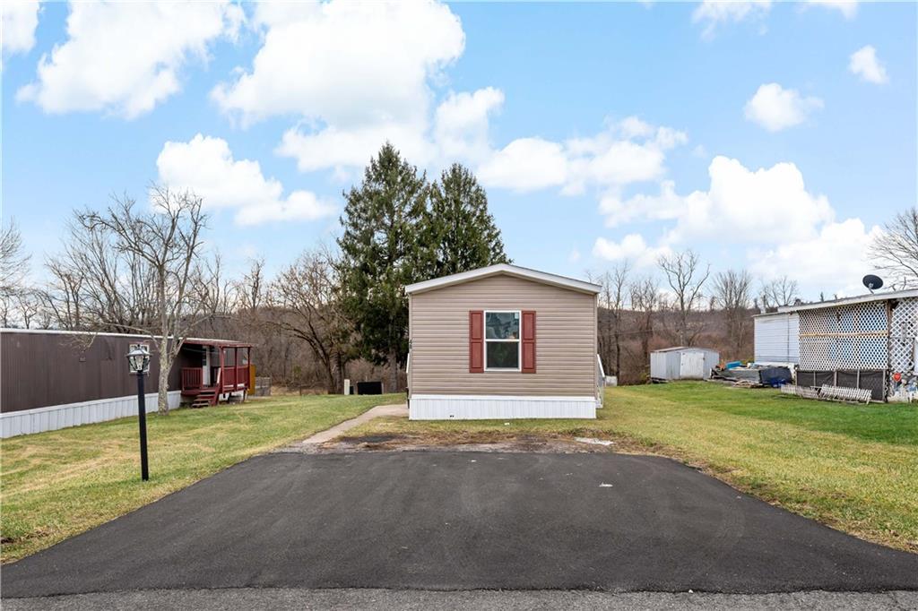 48 Brookhaven Avenue Washington, PA 15301 - Photo 28 of 35 a view of a house with a big yard and large trees