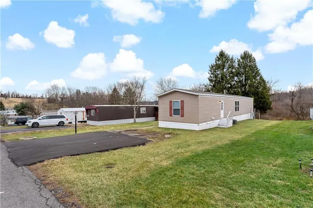 a view of a house with a yard