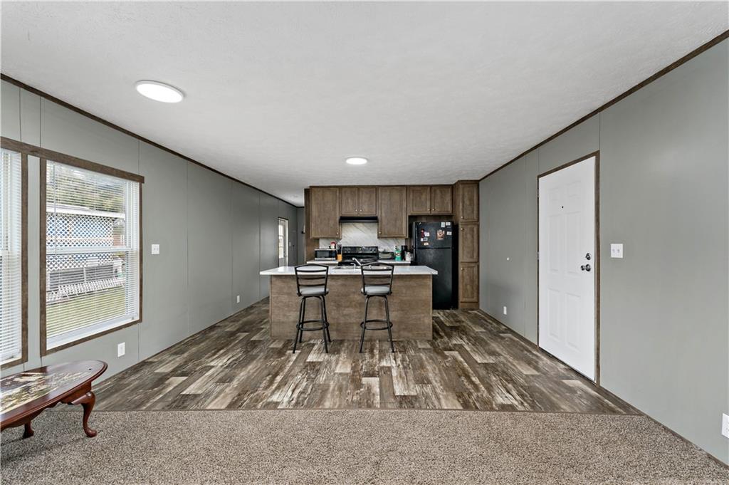 48 Brookhaven Avenue Washington, PA 15301 - Photo 5 of 35 a living room with a couch and a dining table with kitchen view