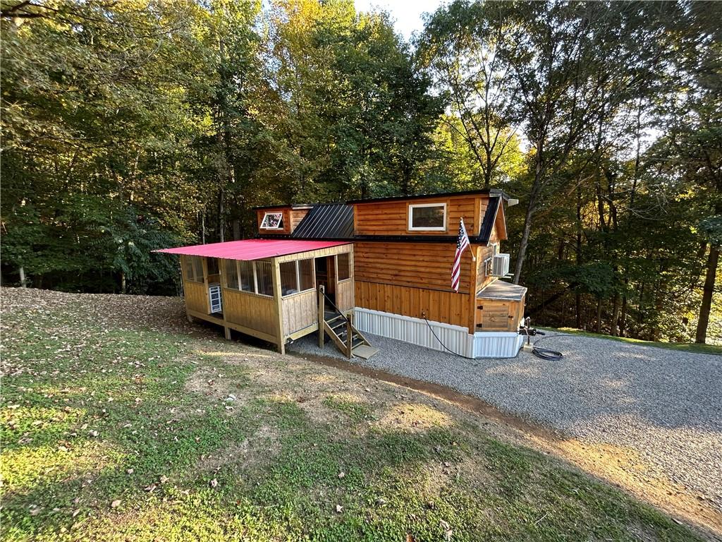 420 Hoy Run Road Spraggs, PA 15362 - Photo 3 of 45 a view of a wooden house with a yard