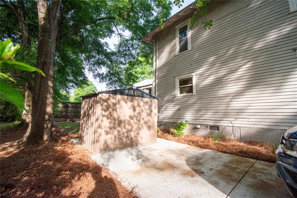 702 Radford Street Monroe, GA 30655 - Photo 49 of 49 a view of backyard with cabin and wooden fence