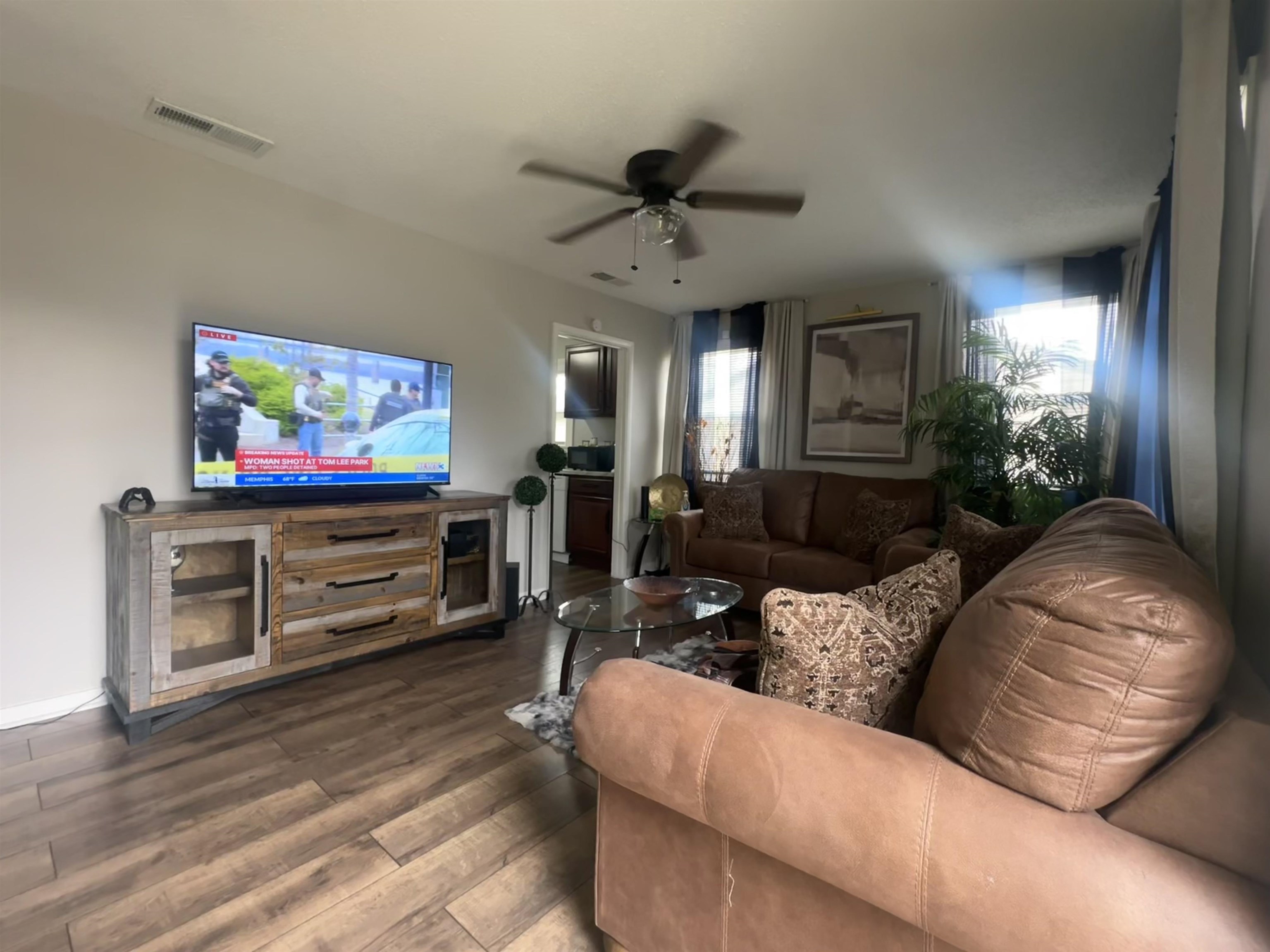 3534 Rochester Road Memphis, TN 38109 - Photo 2 of 13 Living room with dark wood-style floors and ceiling fan