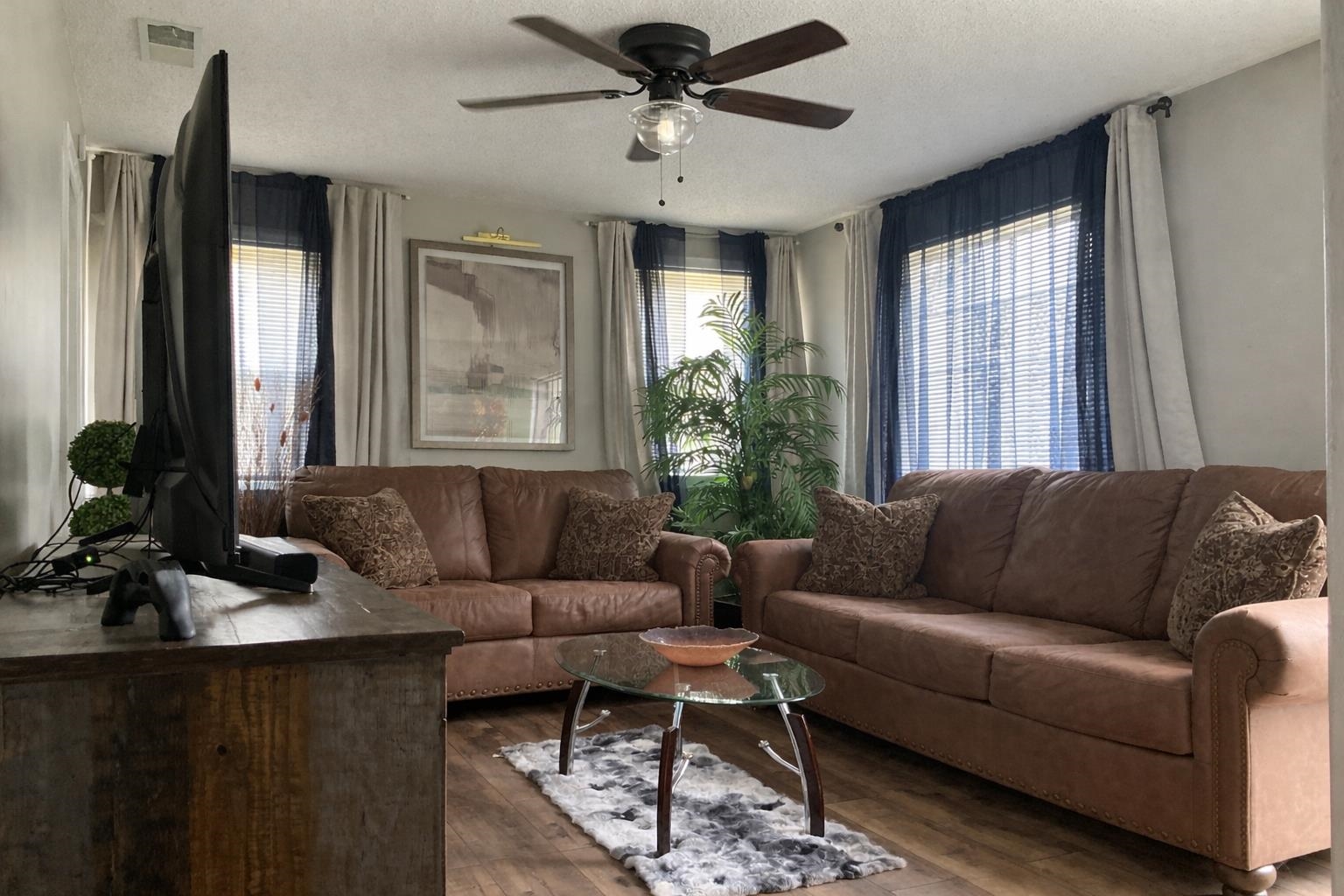 3534 Rochester Road Memphis, TN 38109 - Photo 3 of 13 Living area featuring ceiling fan, wood-type flooring, and a textured ceiling