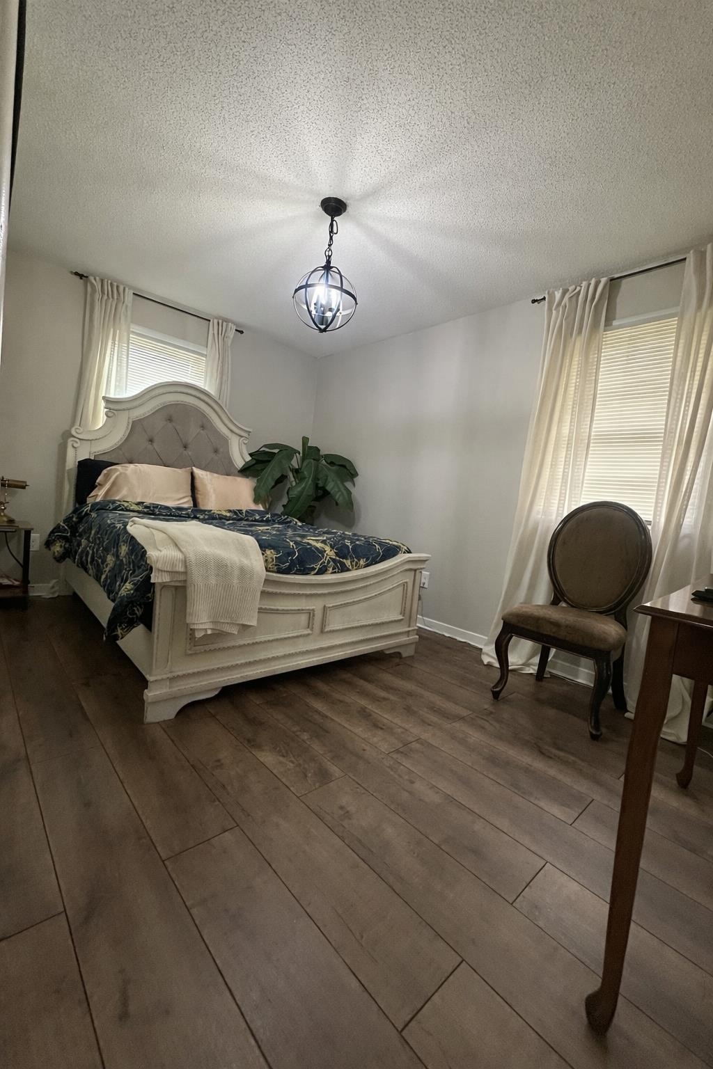3534 Rochester Road Memphis, TN 38109 - Photo 6 of 13 Bedroom featuring hardwood / wood-style floors and a textured ceiling