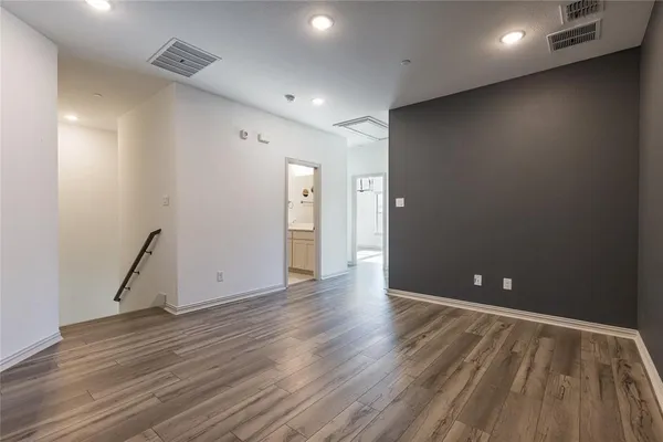 a view of room with wooden floor