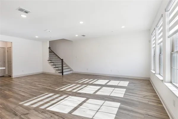 a view of an empty room and stairs