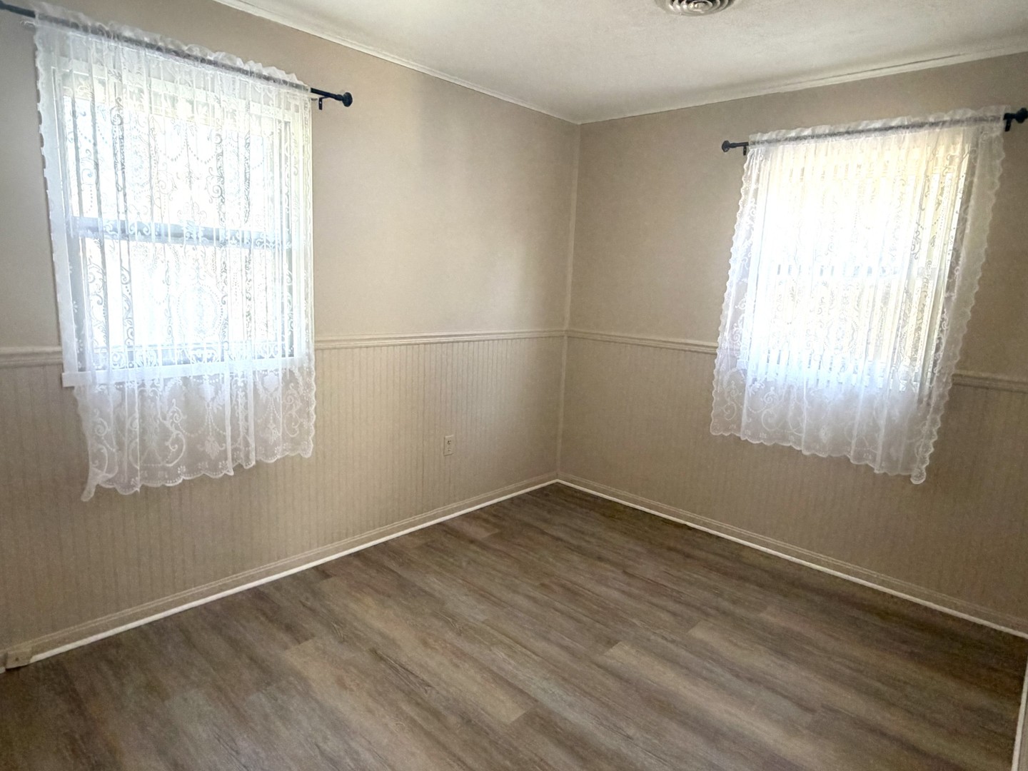 2007 Schuyler Drive Peru, IL 61354 - Photo 6 of 13 a view of a room with wooden floor and windows